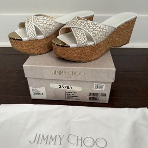 Jimmy Choo wedges. Worn a couple times. Comes with box and dust bags! So comfy!